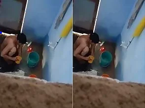 A hidden camera captures an Indian woman bathing.